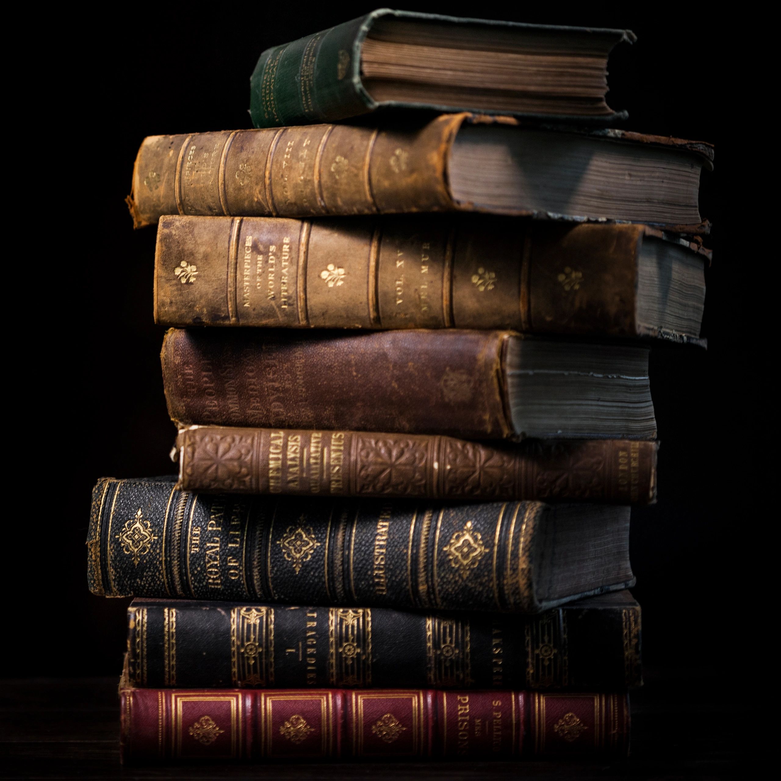 Stack of antique hardcover books